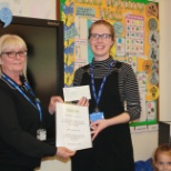 Our Account Manager presenting one of our valued Customers the 'Cleanest Classroom Award'.