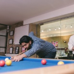 Team playing pool in the office