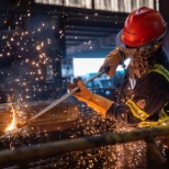 Team member cuts a seamless steel tube